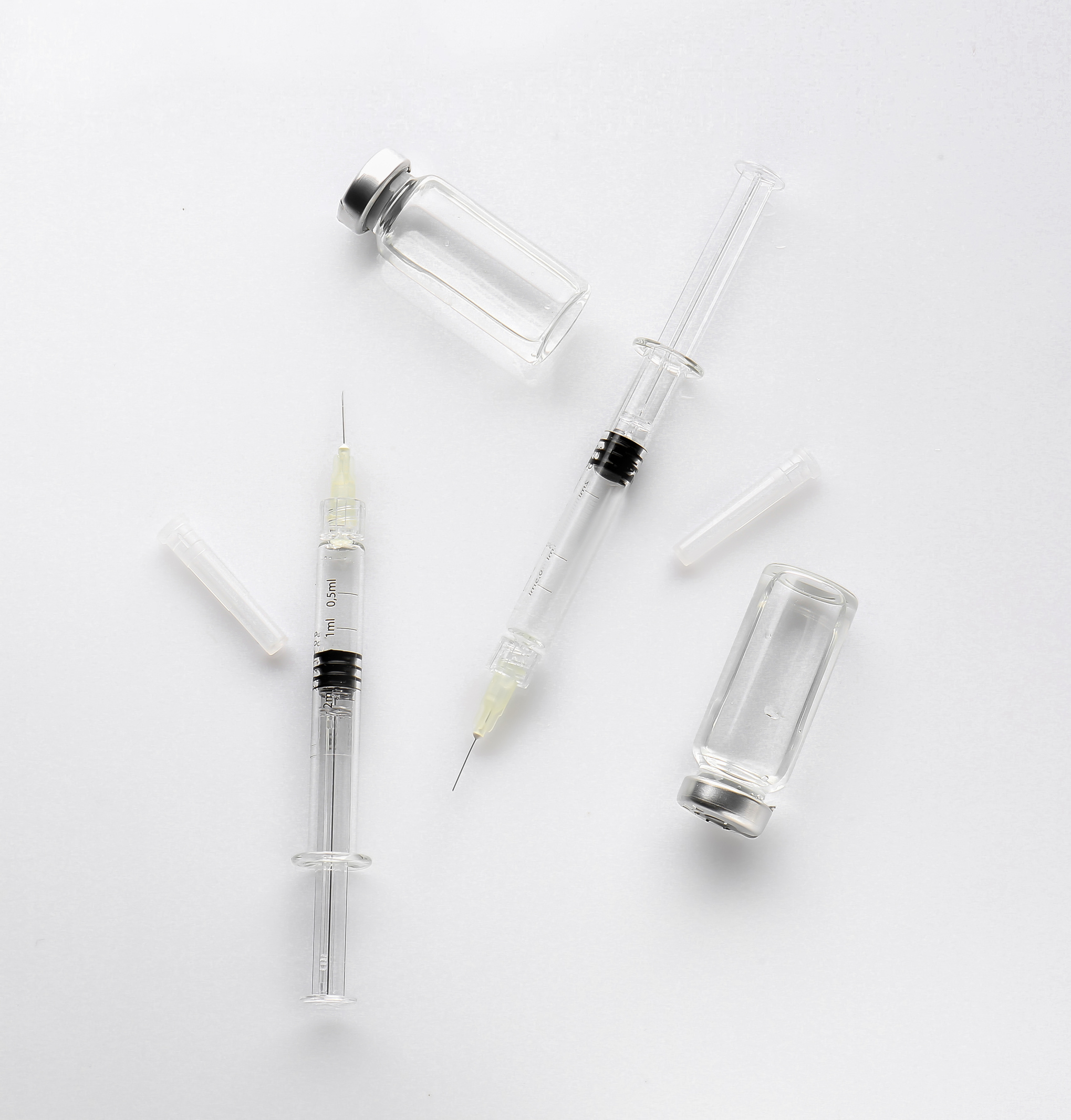 Syringes and Ampules with Filler for Cosmetology on White Background